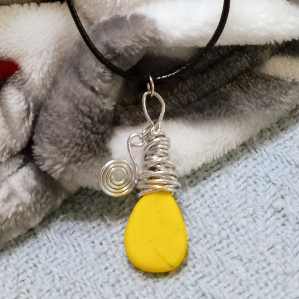 Hand made wire wrapped pendant on black leather cord